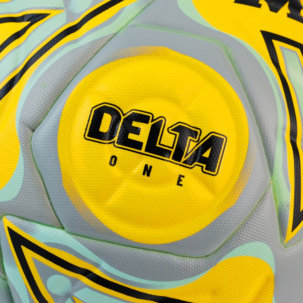 Mitre Delta One football ball with a white and black design, showing close-up of textured surface and brand logo.