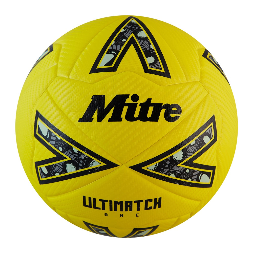 Mitre Ultimatch One football with classic design, showing the black and white panel pattern on a grassy field.