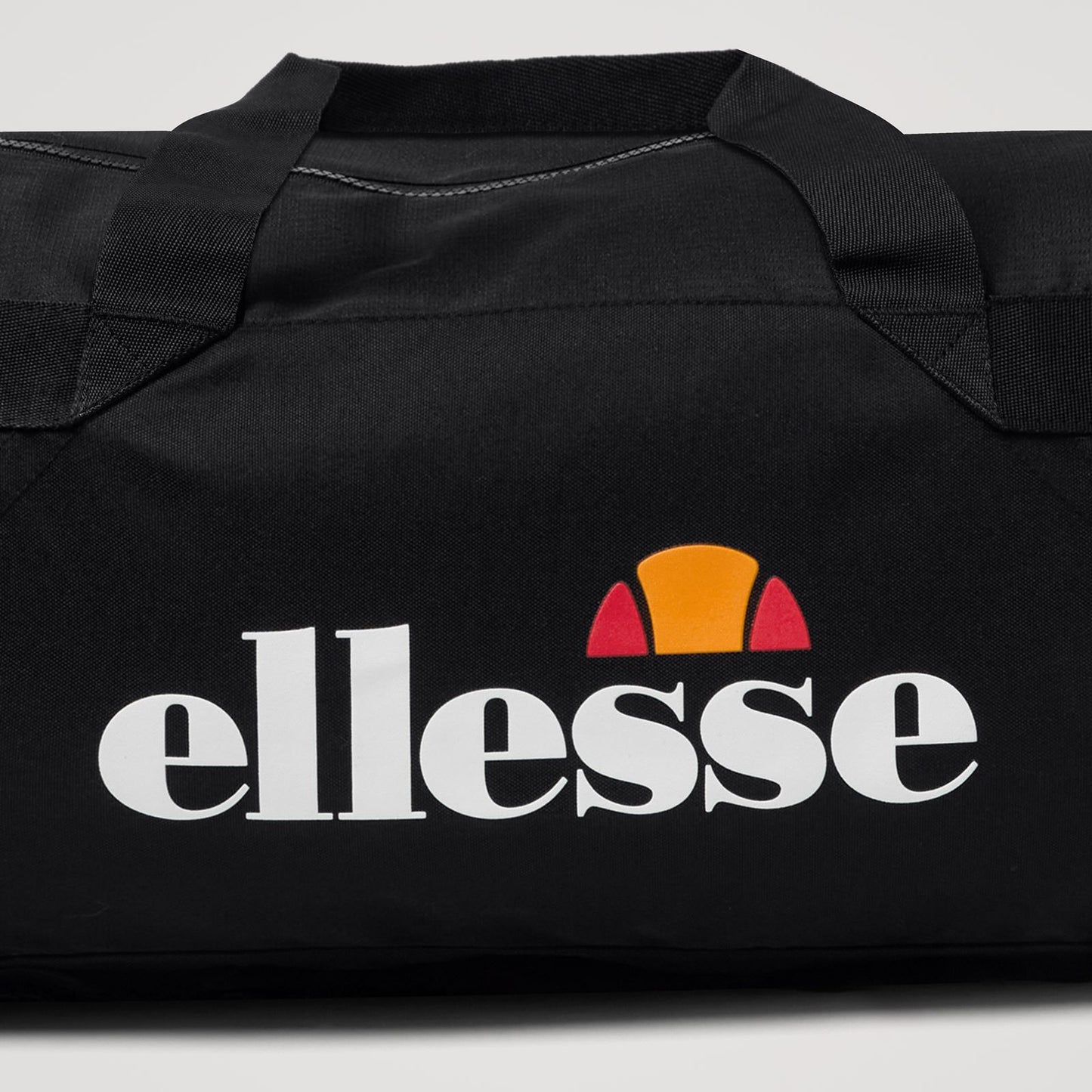 Ellesse Norana Barrel Bag in accessories, featuring a sleek design with adjustable straps and zippered compartments.