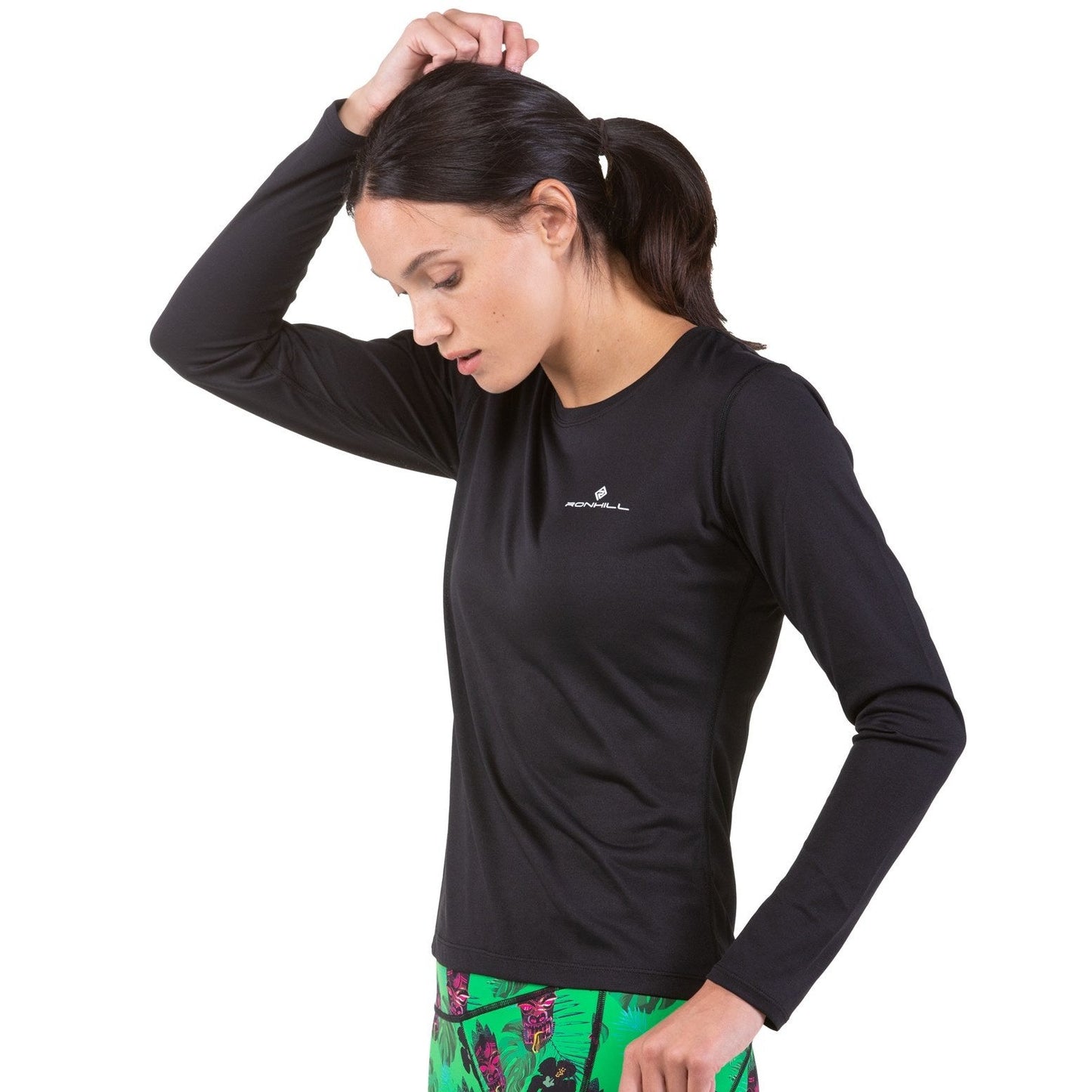 Ronhill women's Core long sleeve running tee in black, lightweight athletic top with fitted design and thumbholes for running comfort.