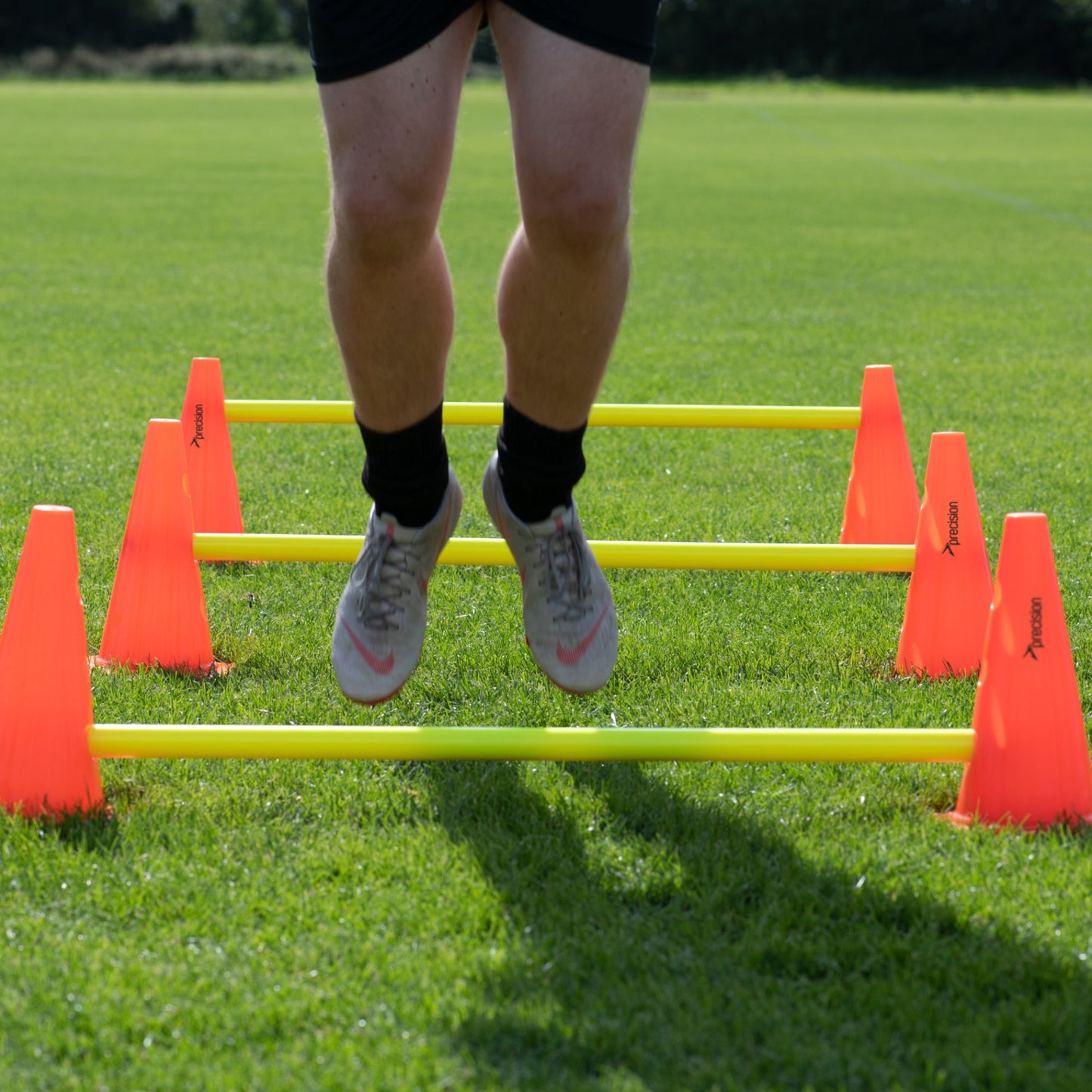 Precision Agility Hurdle Cone Set for sports training, featuring bright orange cones with black bases for agility drills.