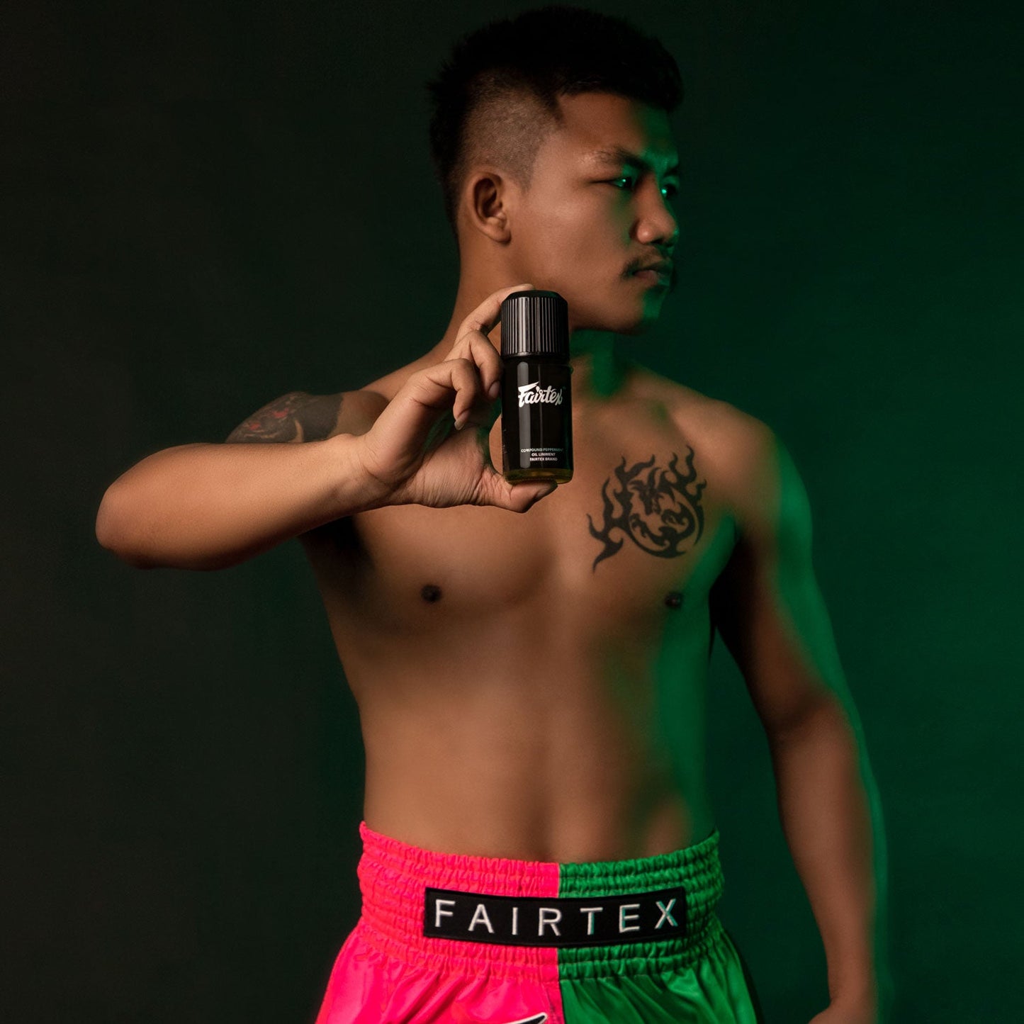 Fairtex Liniment Oil with peppermint scent in a 100ml bottle, used for sports and muscle relief.