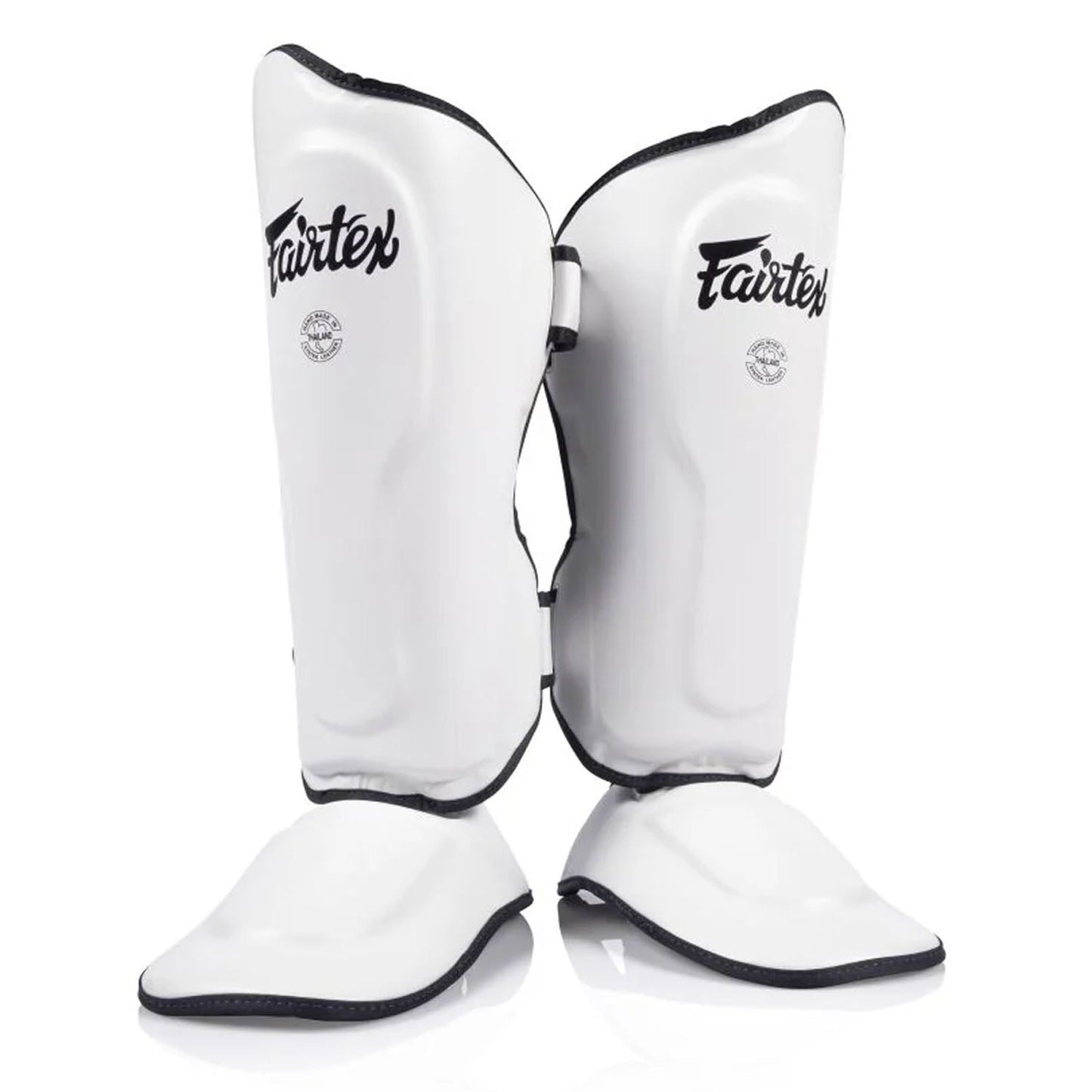 Fairtex SP9 Ultra Ergo white shin pads for martial arts, featuring ergonomic design and padding for protection during training.
