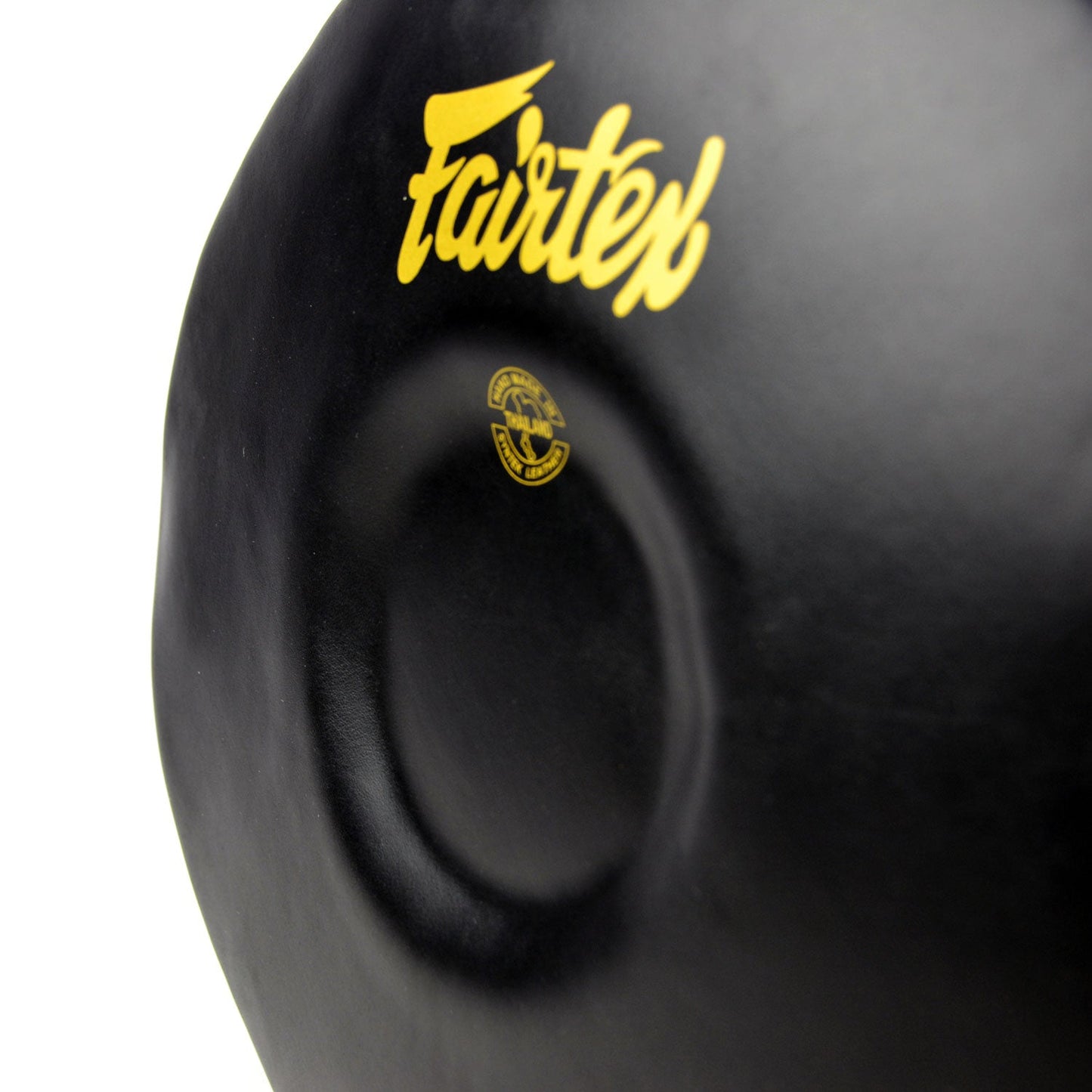Fairtex Donut Pad in black for martial arts training, showing the padded donut-shaped strike surface and sturdy handle.