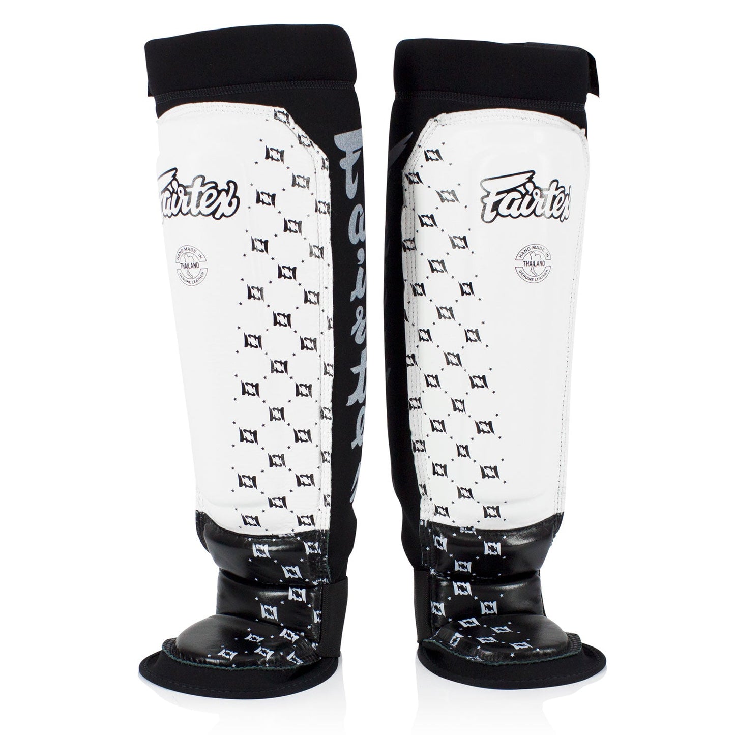 Fairtex neoprene MMA shin pads in white and black with padded protection for martial arts training.