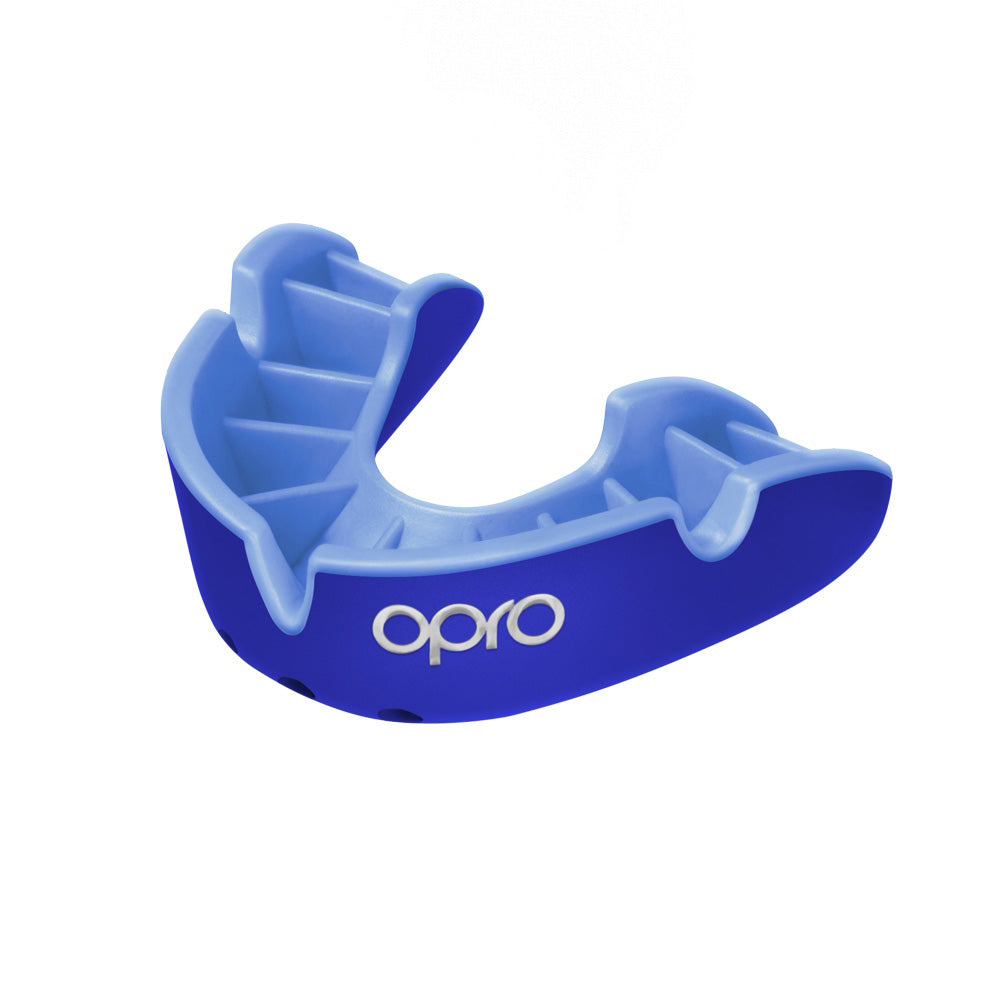 Opro Silver Self-Fit Mouthguard for sports, showing a clear, flexible mouthguard with a silver-colored exterior.