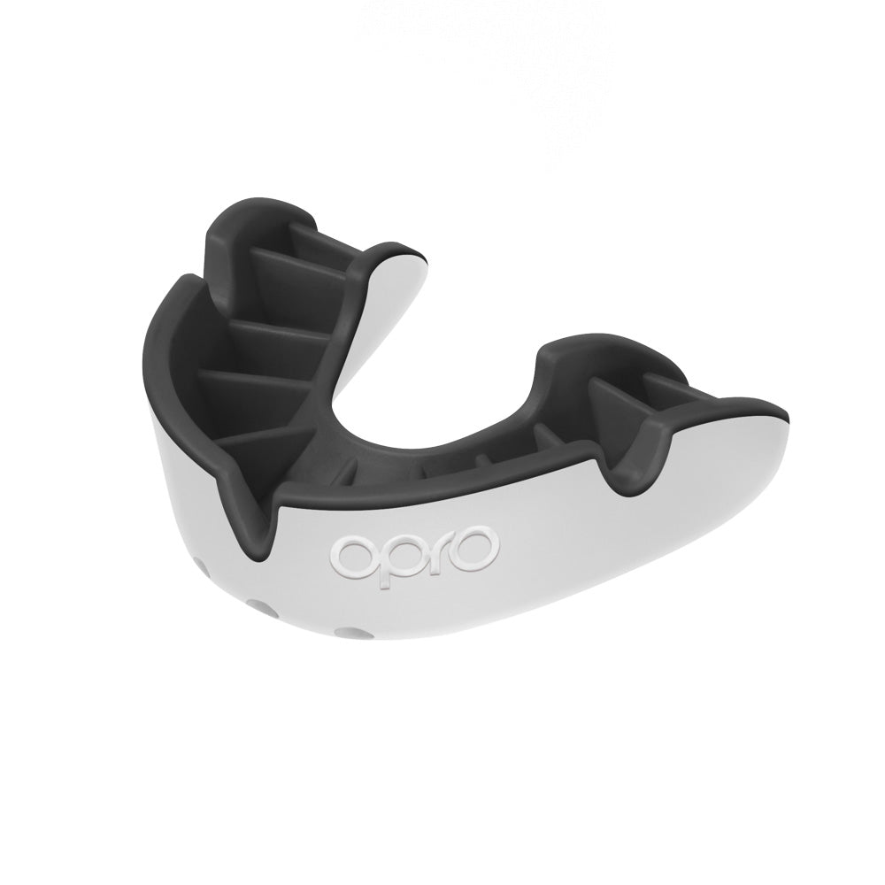 Opro Silver Self-Fit Mouthguard for sports, showing a close-up of the molded protective mouthguard in its case.