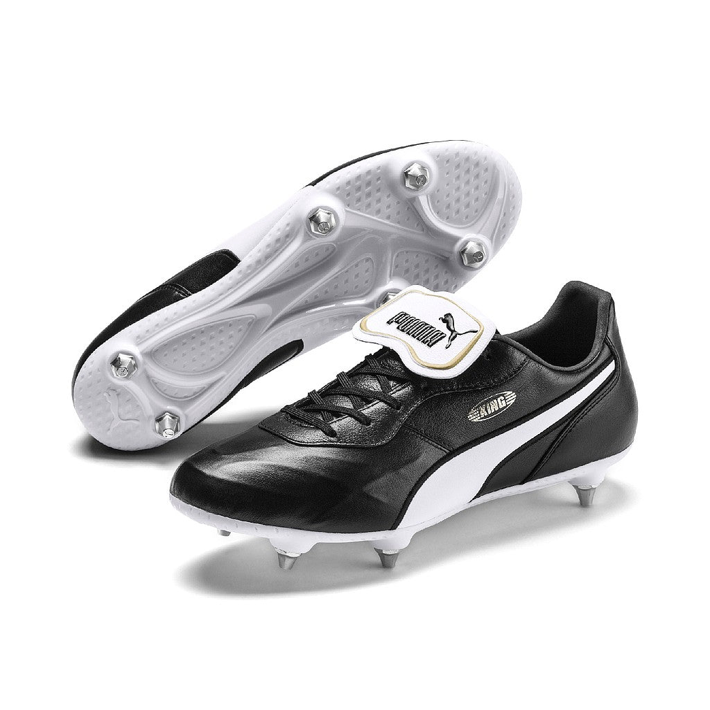 Puma King Top SG football boot with synthetic upper and studded sole for optimal grip on soft grounds.