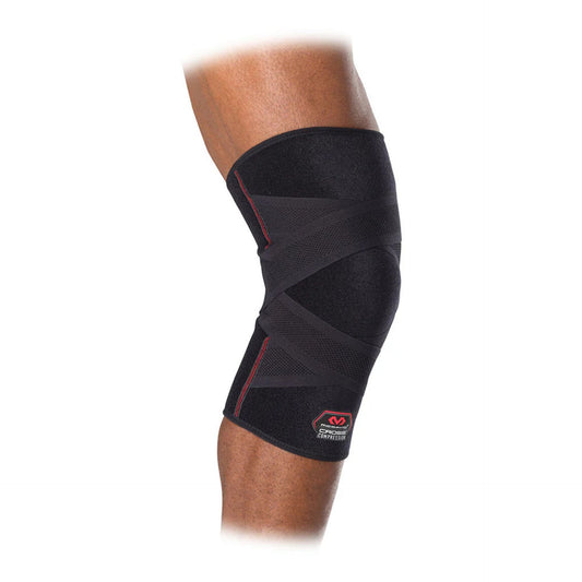 McDavid Cross Compression Knee Sleeve in black with adjustable straps, designed for support and compression during sports activities.