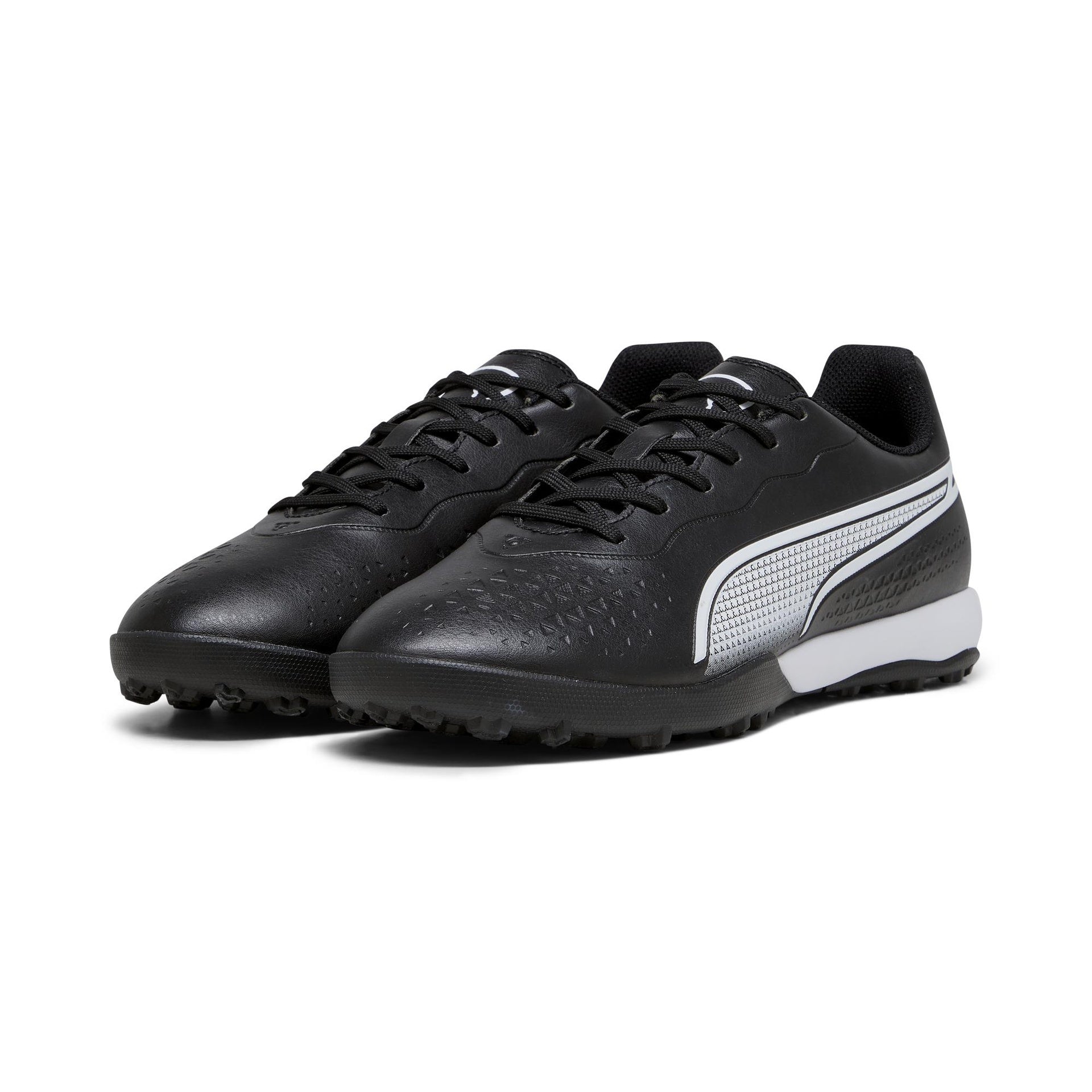 Puma King Match TT astro turf football boots with black and white design, suitable for outdoor soccer play.
