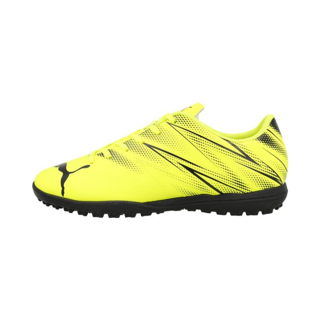 Puma Attacanto Junior TT astro turf football boots with black and white design, suitable for young players on sporting fields.