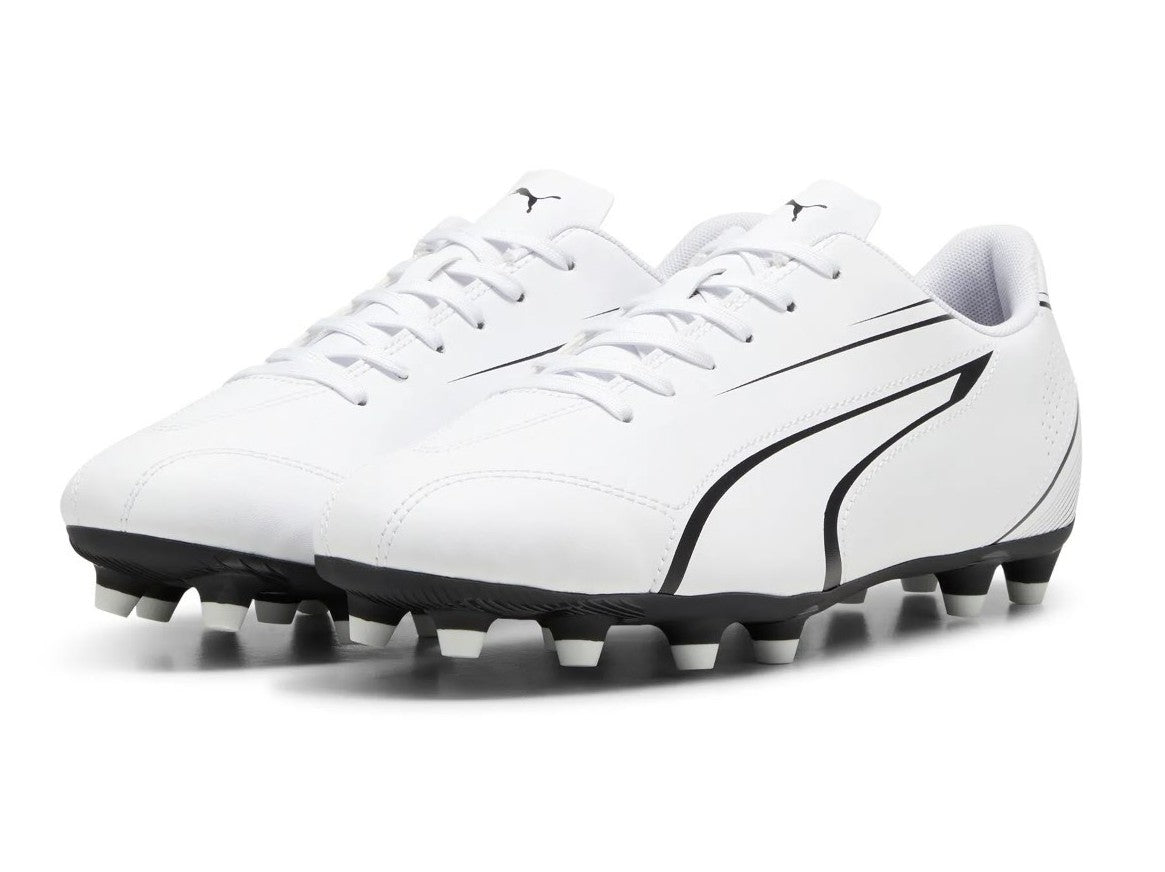 Puma Vitoria FG/AG football boots with black and white design, featuring studded soles for firm and artificial ground play.
