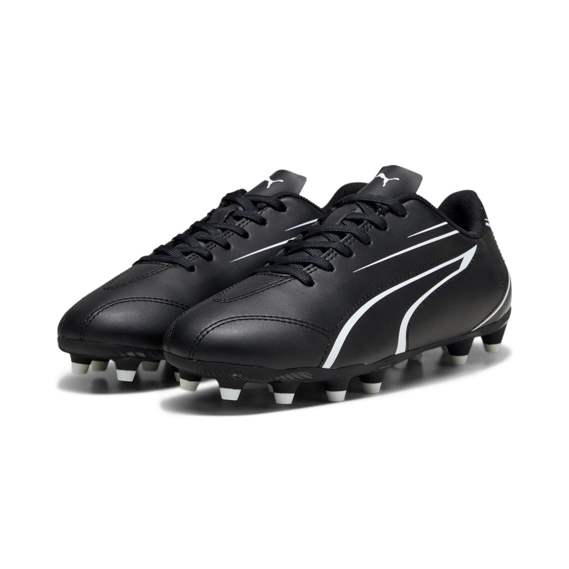 Puma Vitoria FG/AG junior football boots with black and white design, suitable for firm and artificial ground play.