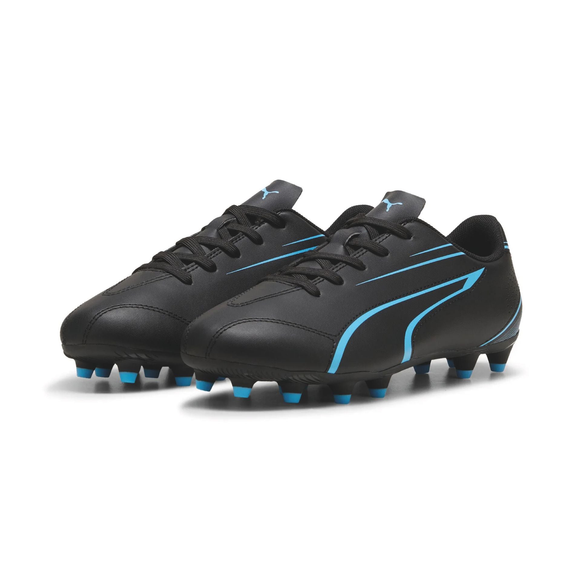 Puma Vitoria FG/AG junior football boots with black and white design, suitable for grass and artificial turf playing surfaces.