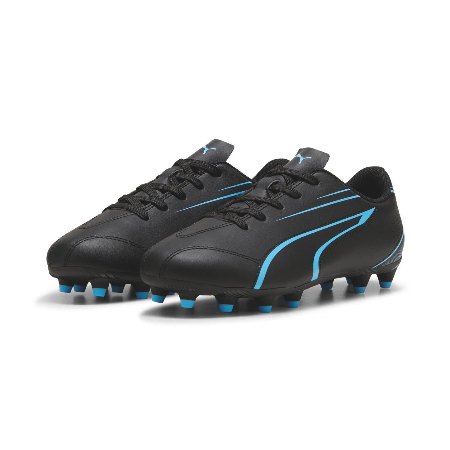 Puma Vitoria FG/AG junior football boots featuring black and white design with studded rubber soles for soccer play.
