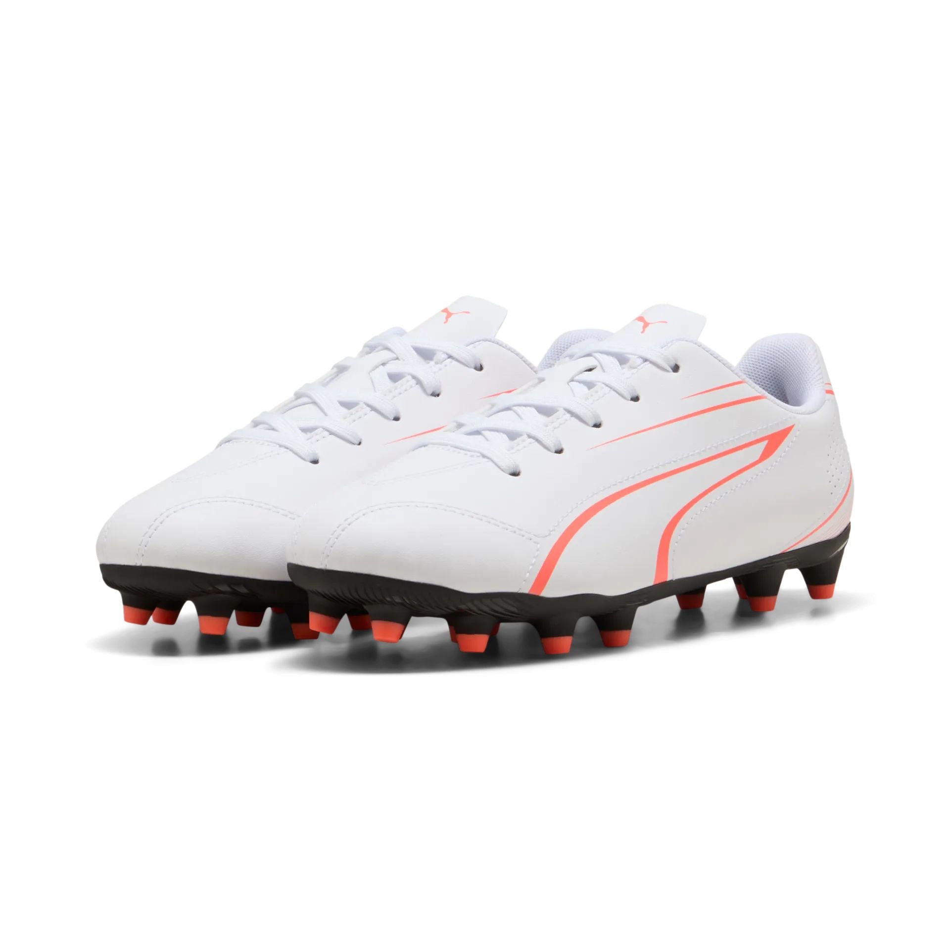 Puma Vitoria FG/AG junior football boots with black and white design, featuring textured upper and studded sole for soccer playing.