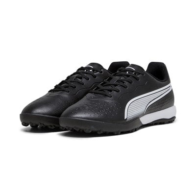 Puma King Match TT astro turf football boots with black and white design, featuring textured upper and rubber sole for outdoor play