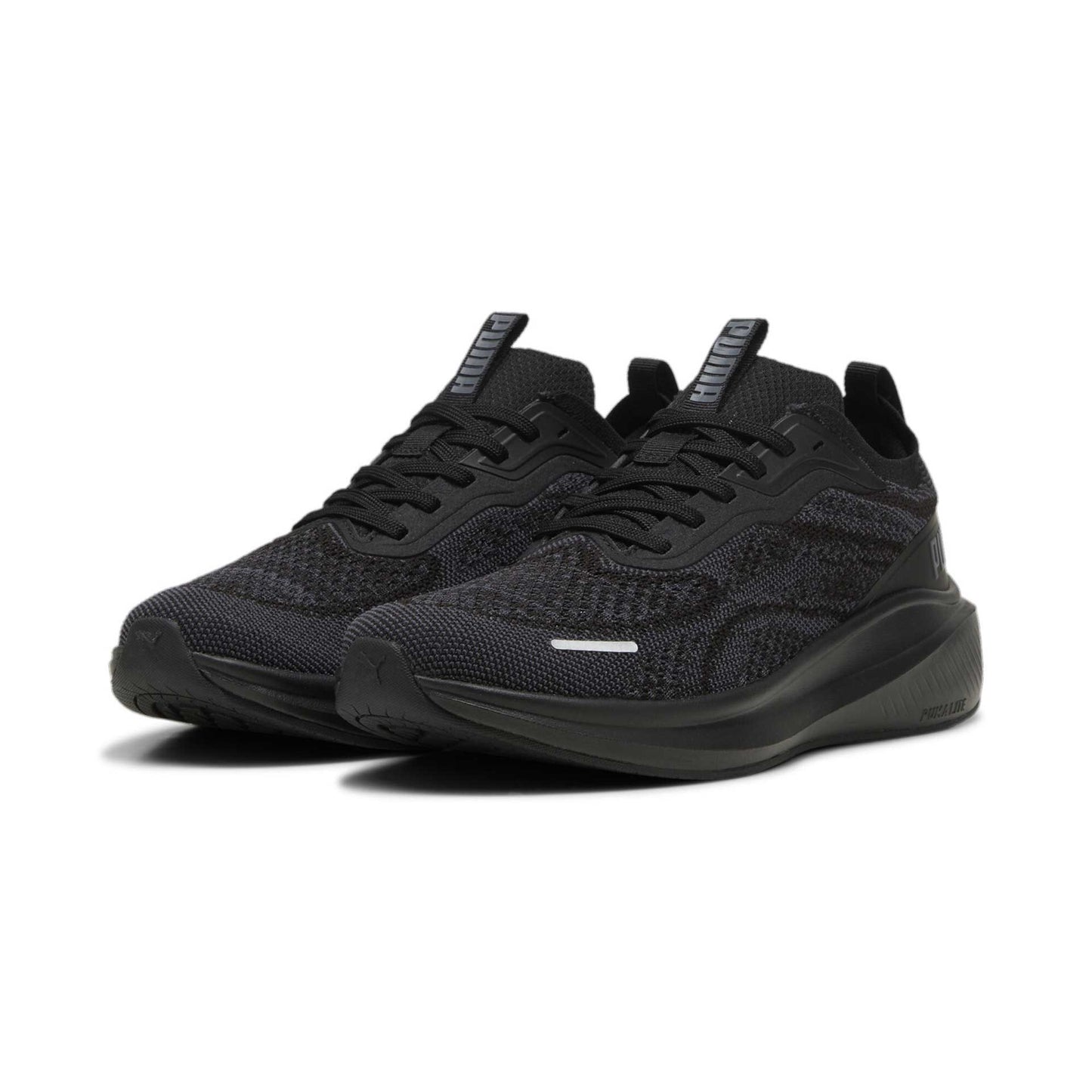 Puma Skyrocket Lite engineered trainer showing navy blue and white athletic sneakers with Puma logo and cushioned sole.