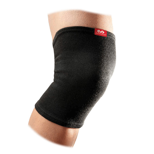Black McDavid 2-Way Elastic Knee Sleeve shown on a knee, providing support and compression for sports and physical activity.