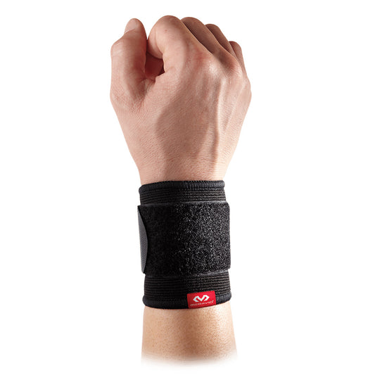 McDavid adjustable 2-way elastic wrist sleeve, black, shown on a person's wrist for support and compression during sports.