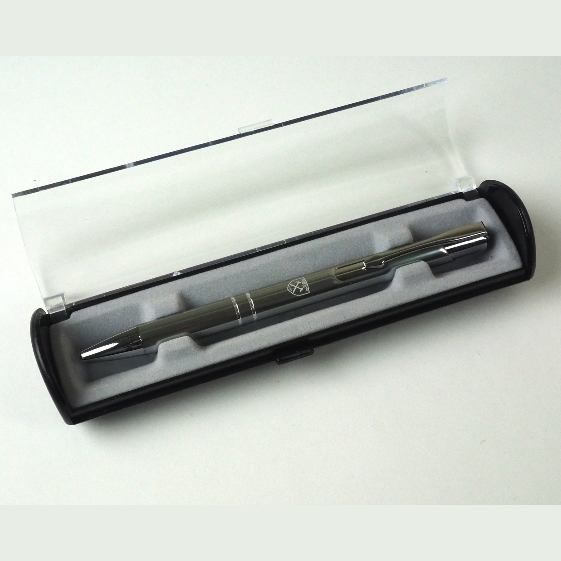 Team Merchandise satin blue ballpoint pen with gift box, sporting goods accessory, featuring sleek design and branded logo.
