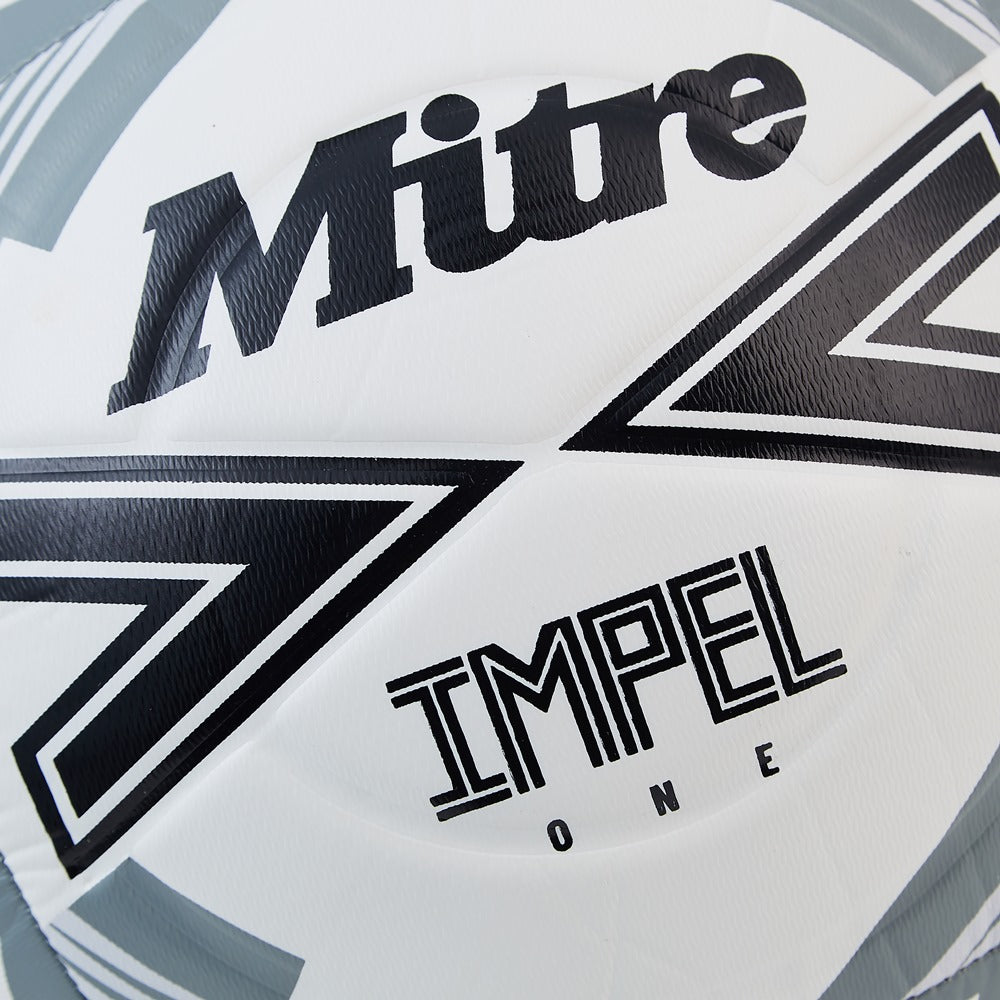 Mitre Impel One football with a black and white geometric pattern, designed for outdoor soccer play.