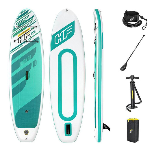 Hydro-Force Huaka'i 10ft inflatable stand-up paddleboard set with paddle, leash, and pump on a sandy beach.