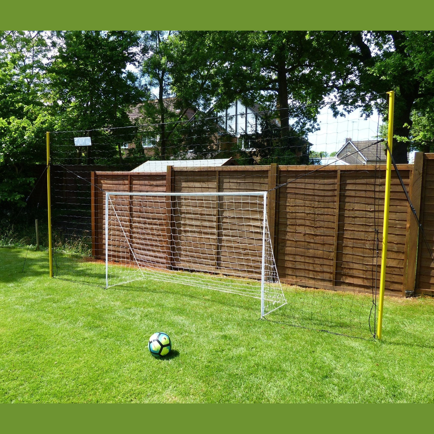 OpenGoaaal! football goal with backstop netting and rebounder for soccer practice and outdoor sports, sturdy sporting goods setup.