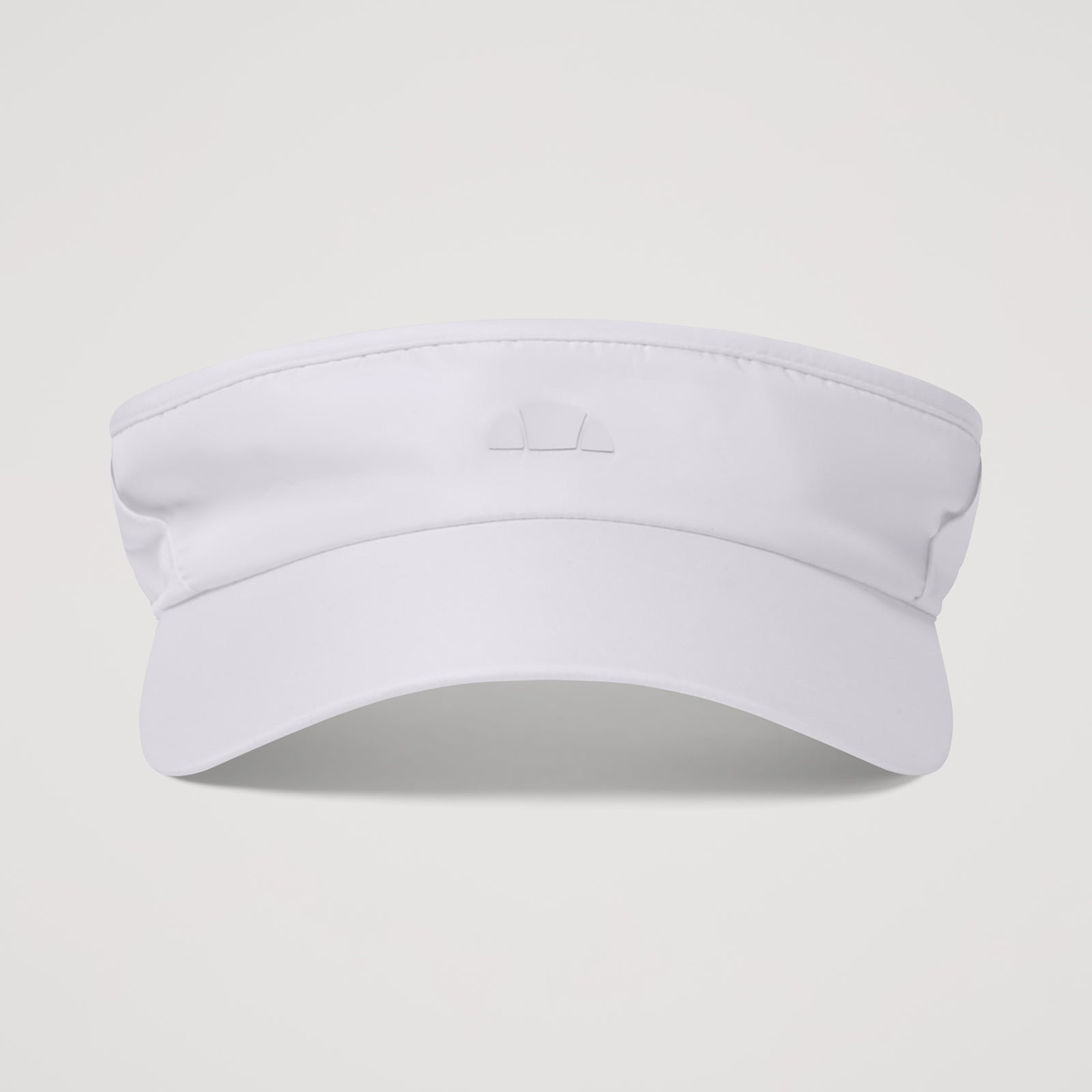 Ellesse Temrila visor in beige with adjustable strap and embroidered logo, designed as a stylish accessory for sun protection.