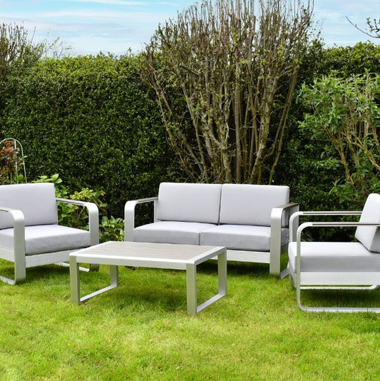 SAC Deluxe Brushed Aluminium Patio Set with four chairs and a rectangular table, outdoor sporting goods for patio dining and relaxation.