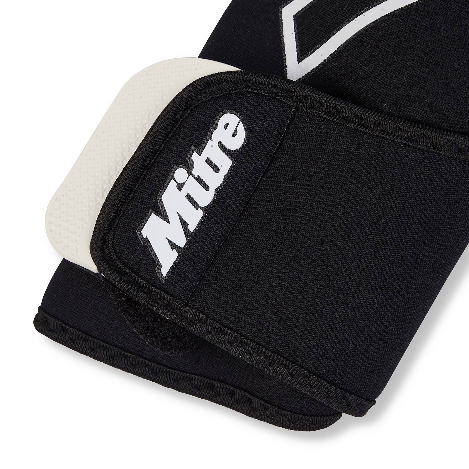 Mitre Junior Impel Goalkeeping Glove with padded palm and adjustable strap for youth football goalkeepers.