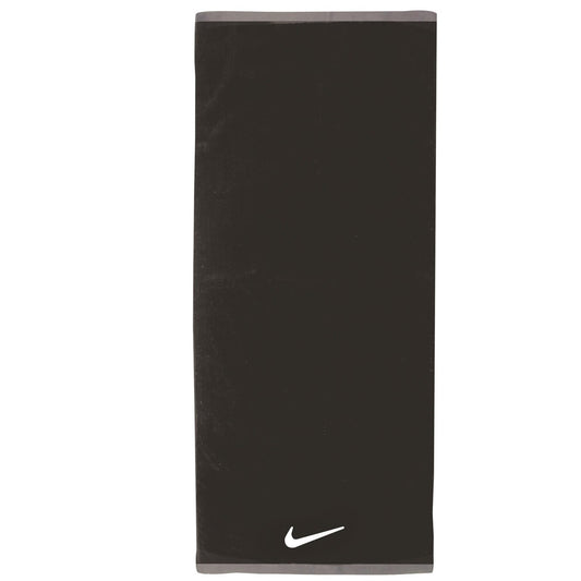 Nike Fundamental towel in white with Nike logo, made of soft cotton, shown folded with textured fabric detail.