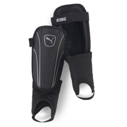 Puma King shin and ankle guards for sports, featuring black padding with Puma logo, designed for protection during gameplay.