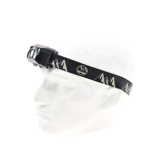 Six Peaks LED head torch with motion sensor, sporting goods, adjustable strap, bright LED light, ideal for outdoor activities.