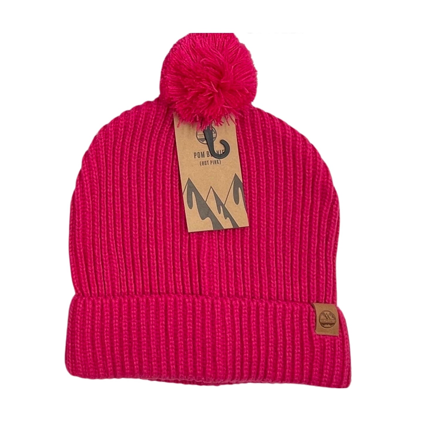 Six Peaks Pom Beanie in black, soft knit fabric with a red pom pom on top, designed for cold weather and outdoor sports.