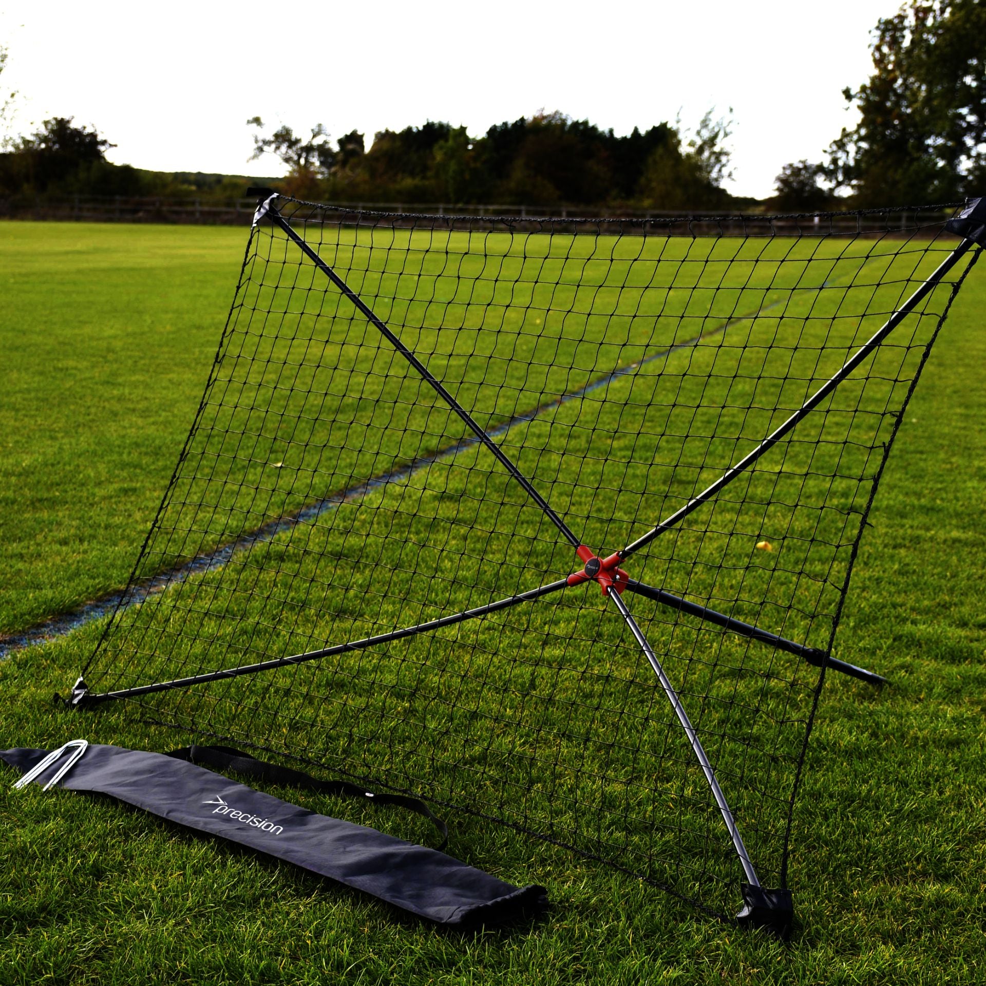 Precision portable rebounder measuring 5' x 3' with a sturdy frame, ideal for sports training and practicing ball rebound drills.
