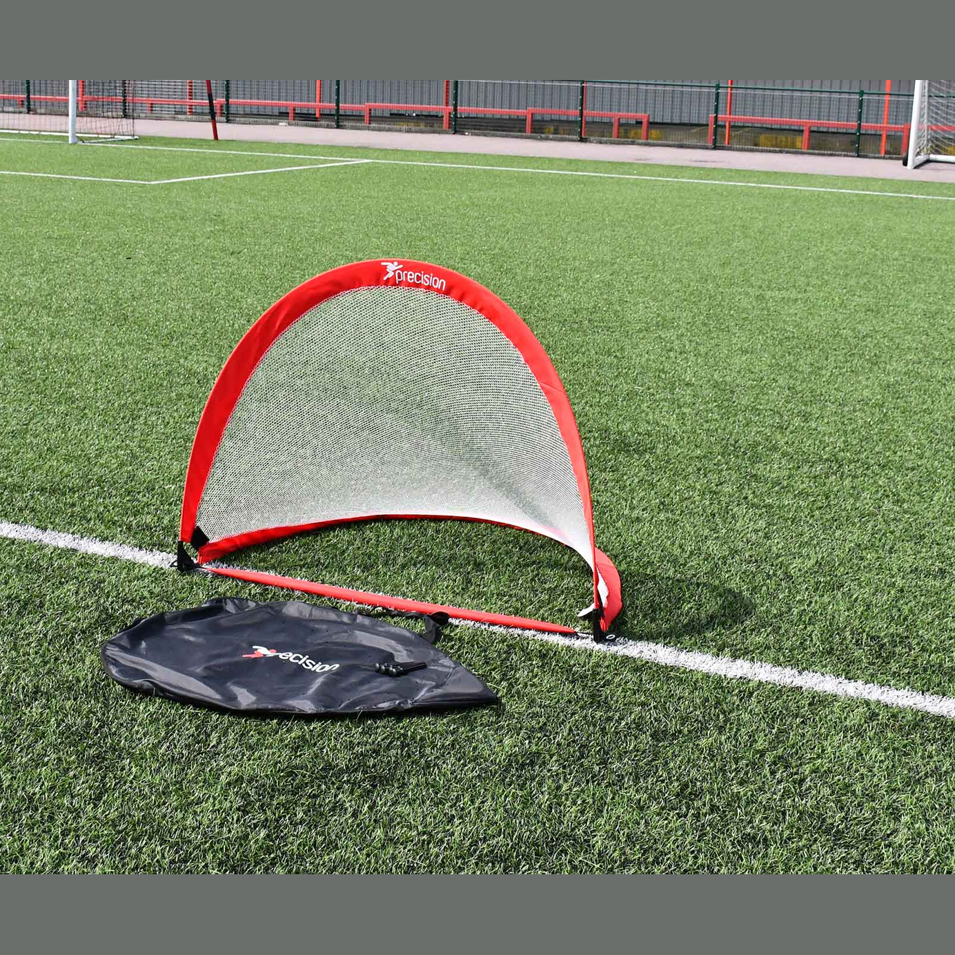 Precision weighted pop-up soccer goal for quick setup and practice, featuring durable frame and easy portability.