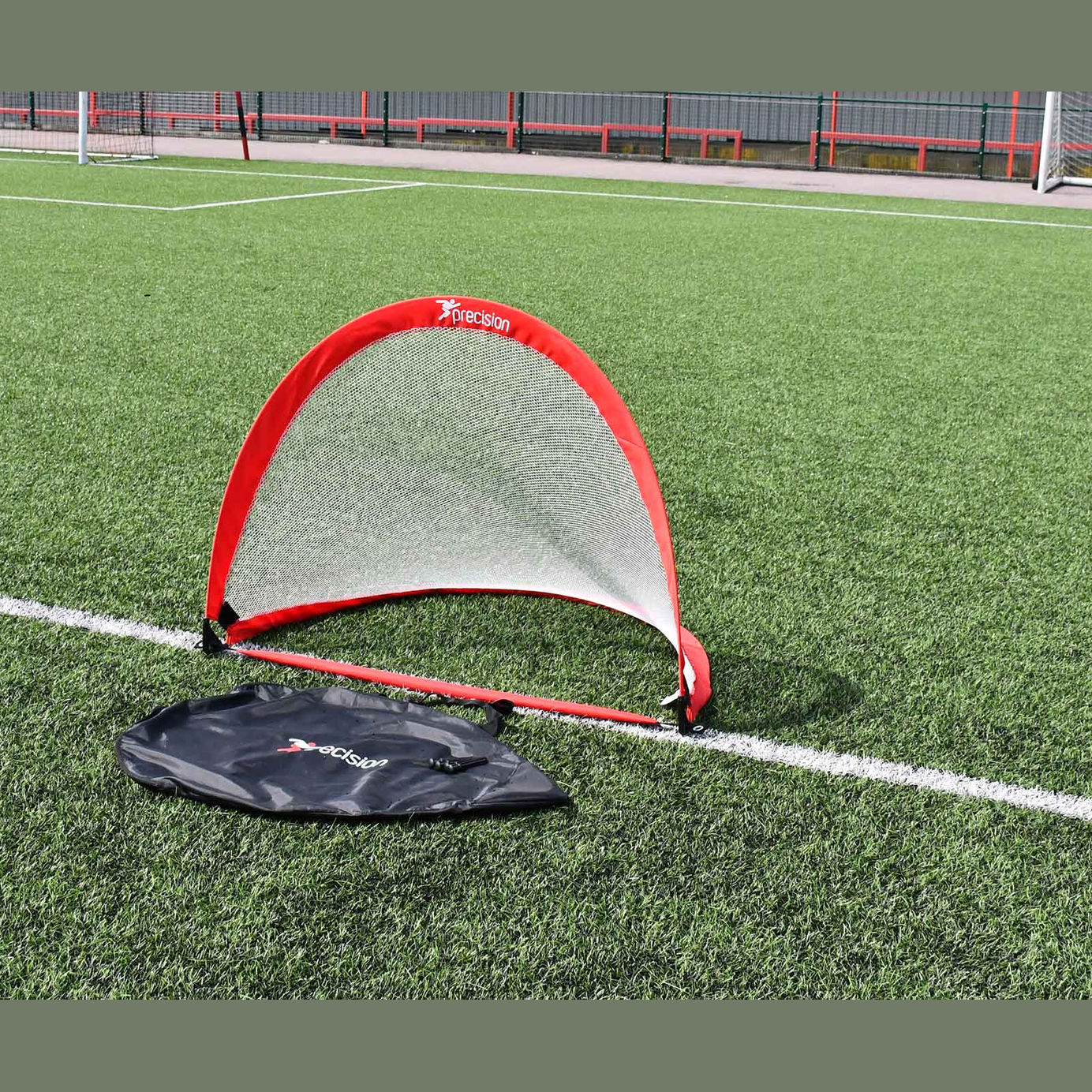 Precision weighted pop-up soccer goal for sporting goods, with a compact frame and easy setup, ideal for soccer practice and games.