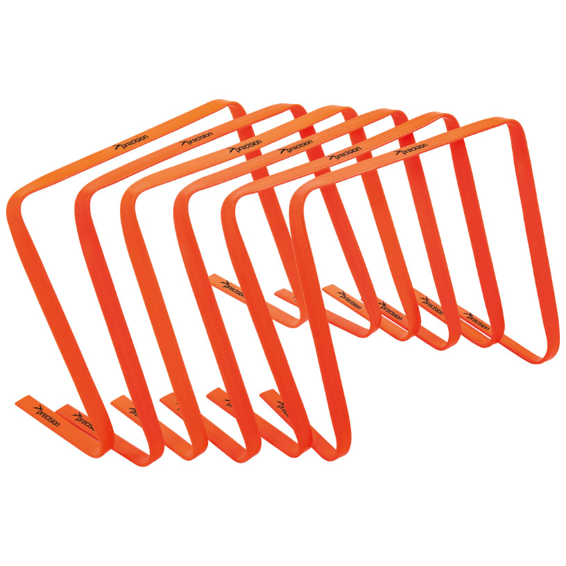 Set of six Precision flat hurdles for sports training, made of durable material, arranged in a line on a gym floor.