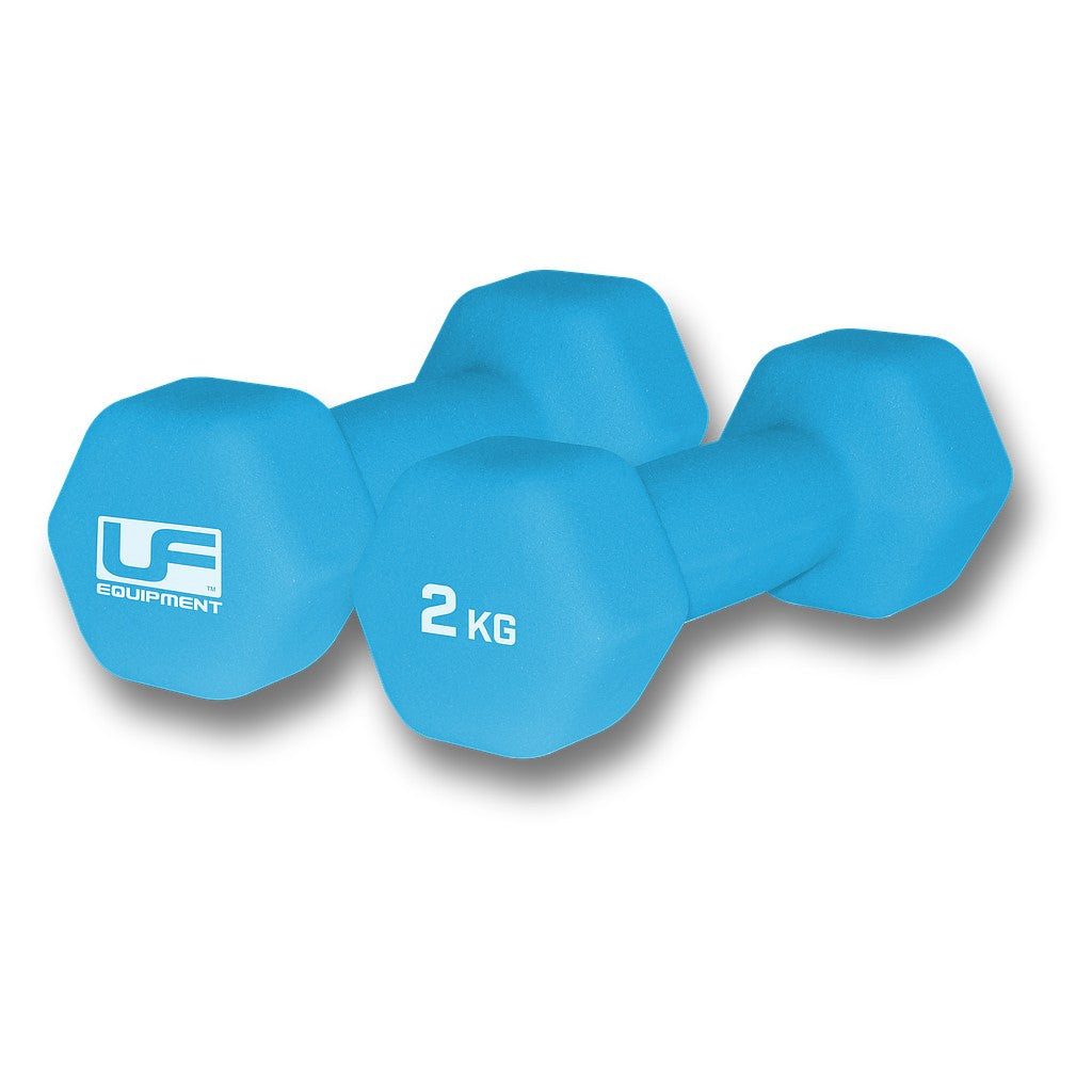 Pair of UFE Urban Fitness neoprene-coated hex dumbbells, black with yellow accents, shown on a gym floor.