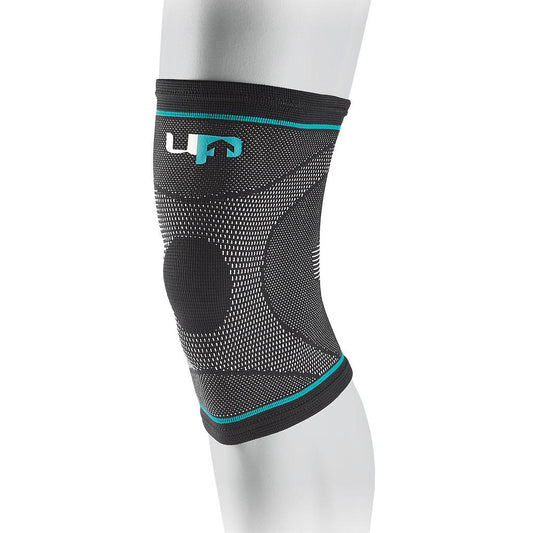 Ultimate Performance compression elastic knee support in black, designed for sports and athletic activities.