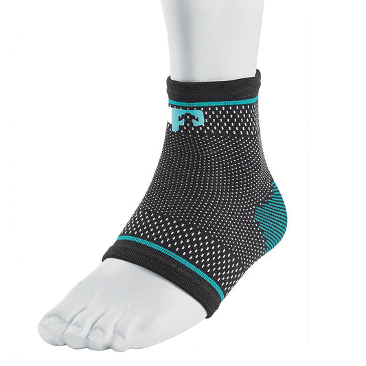 Ultimate Performance compression elastic ankle support in black, designed for sporting goods to stabilize and support ankles during activity.