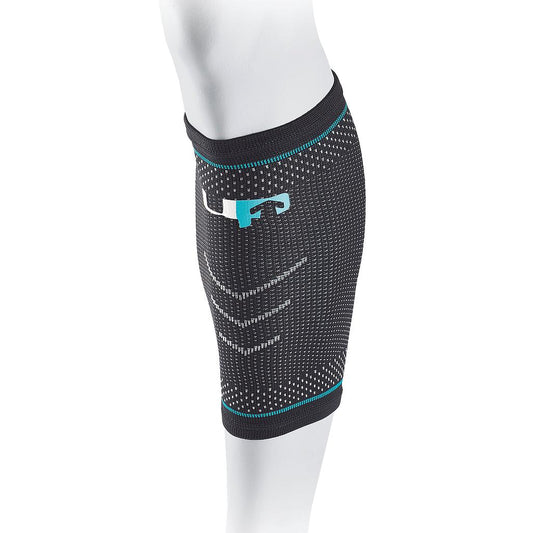 Black Ultimate Performance compression elastic calf support with adjustable strap and breathable fabric for sports and athletic activities.