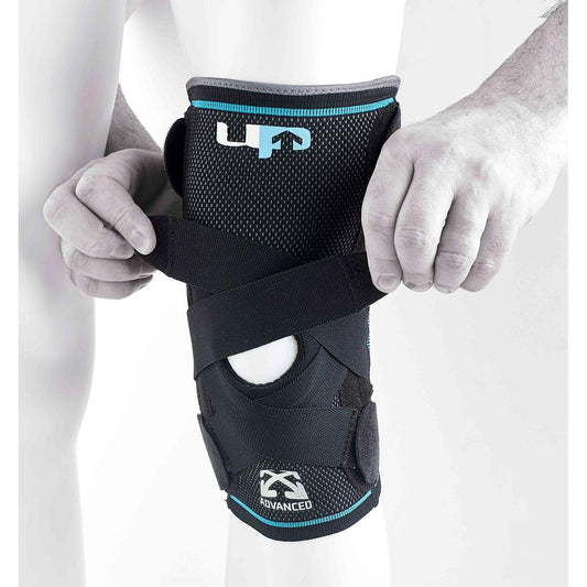 Ultimate Performance Advanced Compression Knee Support with Steel Springs, black design, showing reinforced straps and spring inserts.