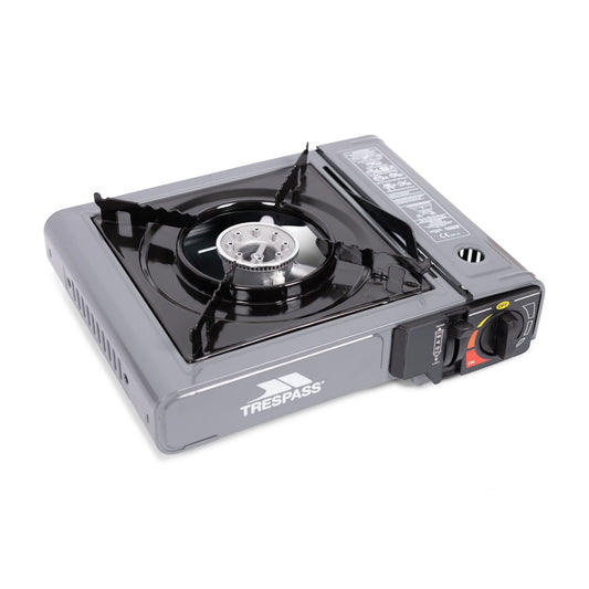Trespass Forna gas stove for outdoor camping, compact and portable with control knobs and fuel connection for outdoor cooking.