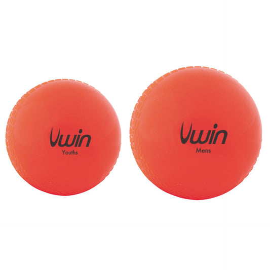 Uwin Training Cricket Ball resting on a cricket pitch, designed for practice and training sessions.