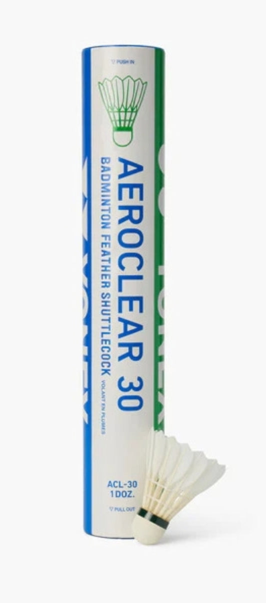 Yonex Aeroclear 30 feather badminton shuttles, white with blue accents, arranged in a row on a wooden court floor.