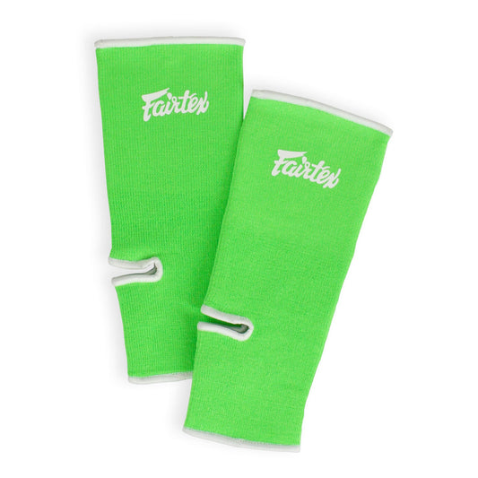 Green and white Fairtex AS1 ankle supports for sports, showing the supportive design and adjustable straps.