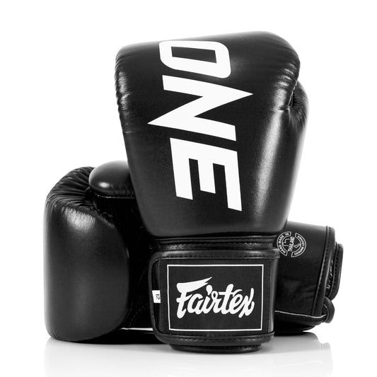 Fairtex X ONE Championship black boxing gloves for training and competition, featuring durable leather and secure wrist support.