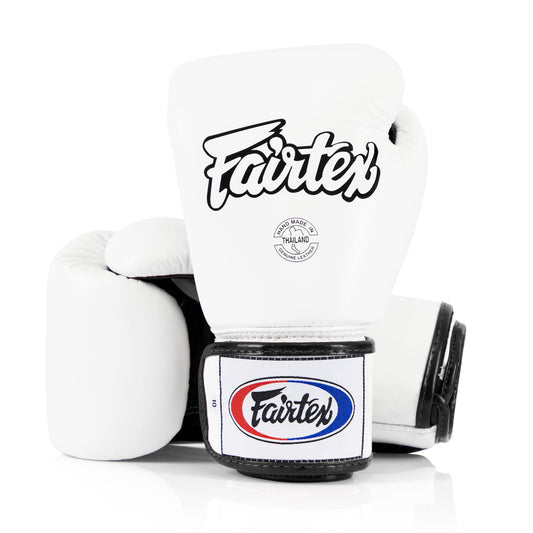 Fairtex BGV1 white universal boxing gloves for training and competition, featuring padded design and secure wrist straps.